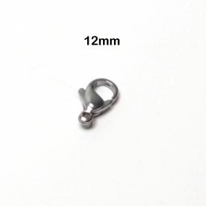 11mm with Secure Lobster Lock Clasp Stainless Steel & White Ceramic with 1in ext Bracelet 11mm with Secure Lobster Lock Clasp Stainless Steel & White Ceramic with 1in ext Bracelet