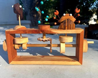 Under-The-Sea automaton toy. Reclaimed redwood. Manually operated mechanical toy with a swimming fish, swirling bubbles, and a hiding crab.