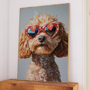 May include: A framed print of a dog wearing heart-shaped sunglasses. The dog has brown, curly fur and a black nose. The red sunglasses have a white border. The artwork is displayed on a wooden cabinet in a living room.