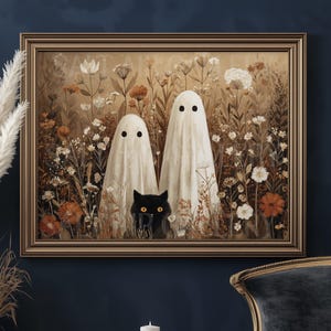 May include: A framed artwork depicts two ghosts in white sheets with black eye holes, standing in a field of flowers. A black cat with yellow eyes is nestled among the flowers. The artwork has a gold frame and a vintage aesthetic.