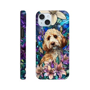 May include: A phone case featuring a golden doodle dog surrounded by colourful flowers. The design has a stained glass effect with shades of blue, purple, and pink. The case also has a black side.