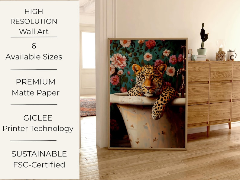 May include: Wall art print featuring a leopard relaxing in a vintage bathtub. The artwork has a floral background with pink and white flowers. The print is framed and displayed in a room with wooden furniture.