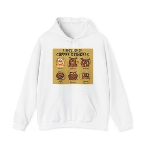 May include: White hooded sweatshirt featuring a graphic with owl illustrations and the text "A HOO'S HOO OF COFFEE DRINKERS." The graphic includes owl characters representing different coffee types: Decaf, Half-Caf, Regular, Irish Coffee, Espresso, and Double Espresso.