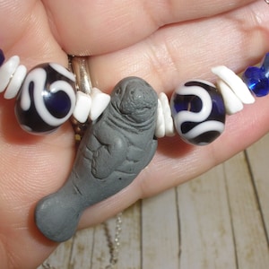 Navy Blue Swirl  Lampwork Manatee Necklace