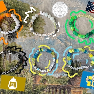 May include: A collection of beaded bracelets in various colors, each with a different word or phrase spelled out in white letter beads. The bracelets are decorated with orange, green, yellow, and black accents, and are themed around a video game.