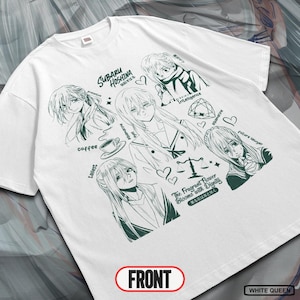 May include: White t-shirt with a green anime-style graphic. The design features multiple character portraits, text in Japanese and English, and the word "FRONT" in a red oval. The shirt also has the text "WHITE QUEEN".