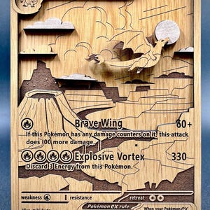 May include: Wooden Charizard EX Pokémon card, laser-cut with a detailed design. Features the text "Charizard EX," "Brave Wing," and "Explosive Vortex." The card has a dragon illustration and a volcano background.