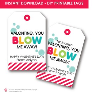 May include: Printable Valentine's Day gift tags with a bubble theme. The tags feature the text "Valentine, You Blow Me Away!" in colourful letters and a red and white striped border. The tags are ready to be printed and used for gifts.