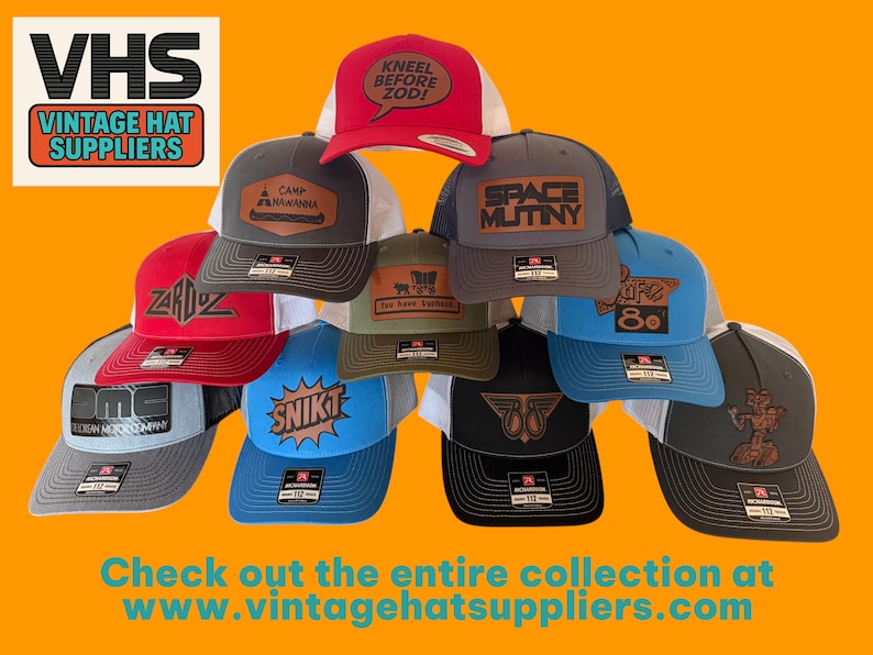 May include: A collection of trucker hats in various colors, featuring embroidered patches with text and graphics. The hats have mesh backs and curved brims. The image includes the text "VHS VINTAGE HAT SUPPLIERS" and "Check out the entire collection at www.vintagehatsuppliers.com."