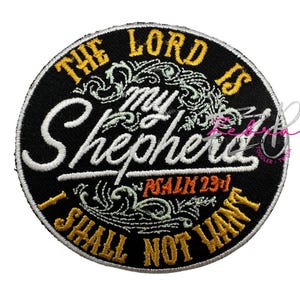 May include: A round, black embroidered patch with the text "THE LORD IS MY SHEPHERD I SHALL NOT WANT" in white and gold lettering. The patch also includes the text "PSALM 23:1".