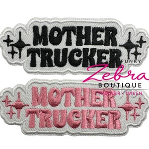 May include: Two embroidered patches with the words "MOTHER TRUCKER" in black and pink, respectively. The patches have a white border with decorative starburst accents. The word "FUNKY" is above the black patch.