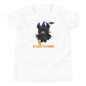 May include: A white short-sleeve t-shirt featuring a black bat-like creature wearing a purple witch hat, holding a broom, and a small spider hanging nearby. The Fuggler logo is visible, and the orange text reads TO CUTE TO SPOOK!