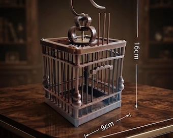 May include: A square brown wooden birdcage with vertical bars, a decorative top hook, and a small arched door. The structure measures 16 cm in height and 9 cm in width, as indicated by the visible measurement markings on the image.