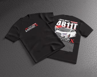 May include: A black short-sleeved t-shirt featuring a white graphic of a Lancer Evolution X car and a 4B11T engine. The front displays the text Lancer Evolution X, while the back includes the car illustration, engine, and descriptive text.