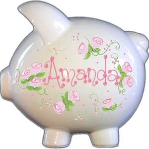 Personalized piggy bank with pink roses in an elegant style that is perfect for a baby shower gift or birthday gift