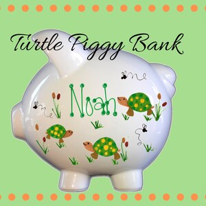 Boy&#39;s personalized piggy bank with green turtles and swamp