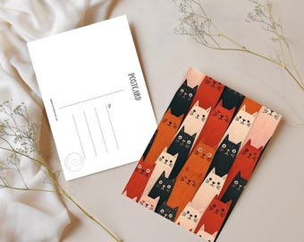 May include: A postcard with a colorful cat pattern and a blank postcard. The cat pattern features various cat faces in black, orange, red, and cream colors. The blank postcard has the word "POSTCARD" printed on it.