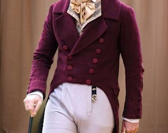 May include: A burgundy double-breasted coat with a notched lapel and matching buttons. The coat is paired with a patterned vest and a cream-colored shirt. The outfit includes light-colored pants.