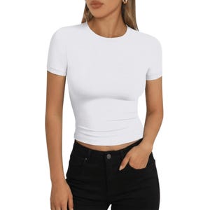 May include: A rustic wooden sign with the text "Welcome to our home" in white lettering. The sign features a distressed finish and a simple, inviting design, perfect for entryway decor.