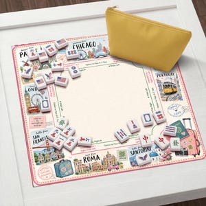 May include: A travel-themed Mahjong set with tiles and a yellow pouch. The game board features illustrations of cities like Chicago, London, and Rome. The tiles are white with various symbols and designs.