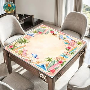 May include: A square tablecloth featuring a watercolor beach theme with a light beige center and a border decorated with surfboards, palm trees, hibiscus flowers, beach chairs, waves, a camper van, and seashells in vibrant pink, blue, and green.