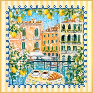 May include: A watercolour painting shows a Venetian canal scene with vibrant buildings, lemons, and a breakfast table. Two cups of coffee and a croissant are on a table with a floral tablecloth. The painting is framed with a blue and white border.