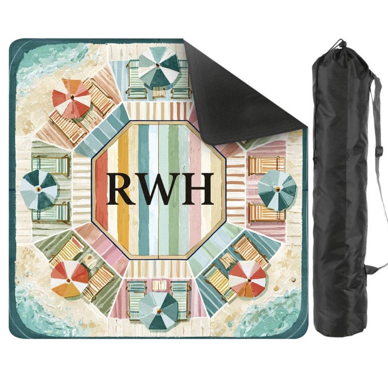 May include: A beach blanket with a colorful beach scene design, featuring beach umbrellas, lounge chairs, and the initials "RWH" in the center. Includes a black carrying bag with a shoulder strap. The blanket is square-shaped.