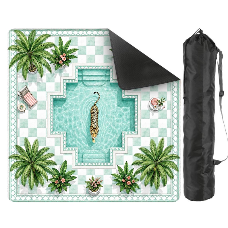 May include: A square outdoor mat featuring a top-down view of a swimming pool with a leopard swimming in the center, surrounded by palm trees, lounge chairs, and a checkered tile border. The mat has a black underside and includes a black carry bag.