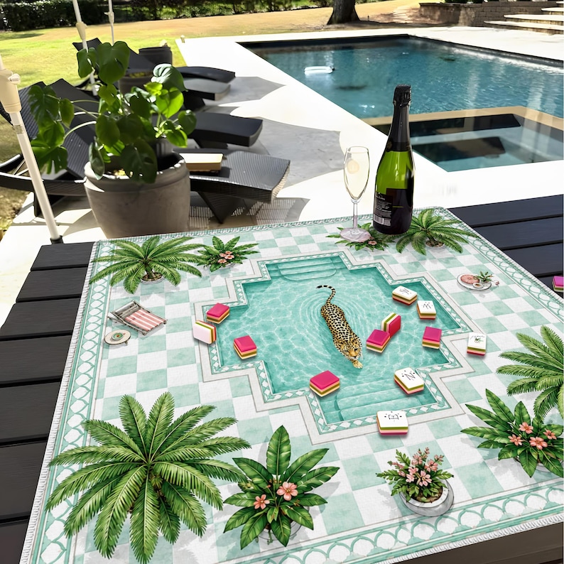May include: A square tablecloth featuring a light green and white checkered pattern with a central swimming pool illustration, a leopard swimming in the pool, scattered mahjong tiles, and palm tree motifs around the border.