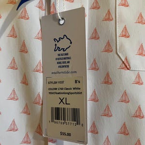 May include: White button-down shirt with a repeating pattern of orange sailboats. The shirt has a tag that reads "INTERCOASTAL" and "southern tide.com". The tag also says "XL" and "YSSICFloatinAlongSportshirt".