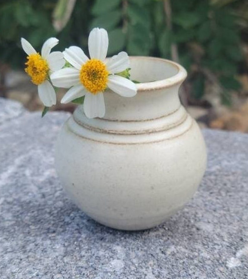 Vase smaller than a bud vase for roadside and wild flowers in a soft yellow finish