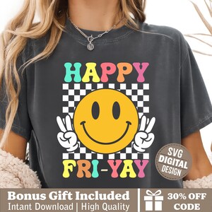 May include: Dark gray t-shirt with the words "HAPPY FRI-YAY" in colorful retro font, featuring a yellow smiley face with peace signs. The shirt has a checkerboard background and the text "SVG DIGITAL DESIGN".
