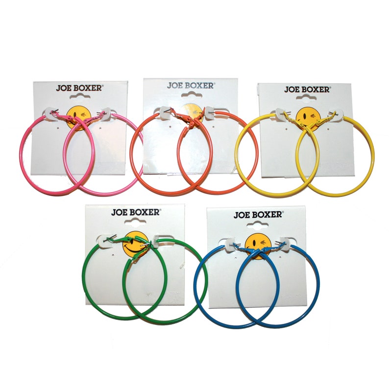May include: Six pairs of colorful hoop earrings on white cards with the brand name "JOE BOXER" printed on them. The earrings are in pink, orange, yellow, green, and blue.