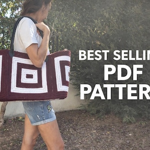 May include: A large, rectangular crochet tote bag with a geometric pattern in burgundy and white. The bag is carried by a person. The text "BEST SELLING PDF PATTERN" is displayed in white.