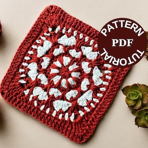 Puede incluir: Un cuadrado de ganchillo rojo y blanco con un diseño floral, etiquetado como "PATTERN PDF TUTORIAL". El cuadrado está rodeado de rosas de hilo rojo y suculentas verdes. La bandera británica está en la esquina inferior izquierda.