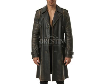 May include: A distressed black leather trench coat with a double-breasted design. The coat features a notched collar, button closures, and epaulettes. The text "DRESTIN LEATHER FASHION" is visible on the coat.