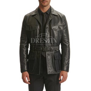 May include: Black leather jacket with a belted waist, four front pockets, and a collared neckline. The jacket has a classic design and is suitable for various occasions. The jacket has the text "DRESTIN LEATHER FASHION" printed on it.