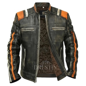 May include: Distressed black leather jacket with orange and white stripes on the sleeves and shoulders. Features a quilted brown lining and multiple zippered pockets. The jacket has a vintage, worn look.