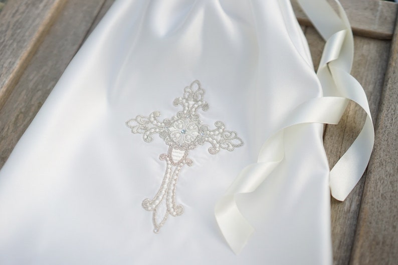 Gold intricate embroidery on a baby Baptism blanket with matching bib from www.lyubove.co.uk Lyubove Christenings