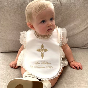 Baptism bib in white or cream with a cross of your choice from www.lyubove.co.uk Lyubove Christenings