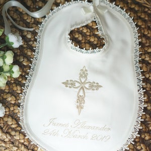 Gold intricate embroidery on a baby Baptism blanket with matching bib from www.lyubove.co.uk Lyubove Christenings