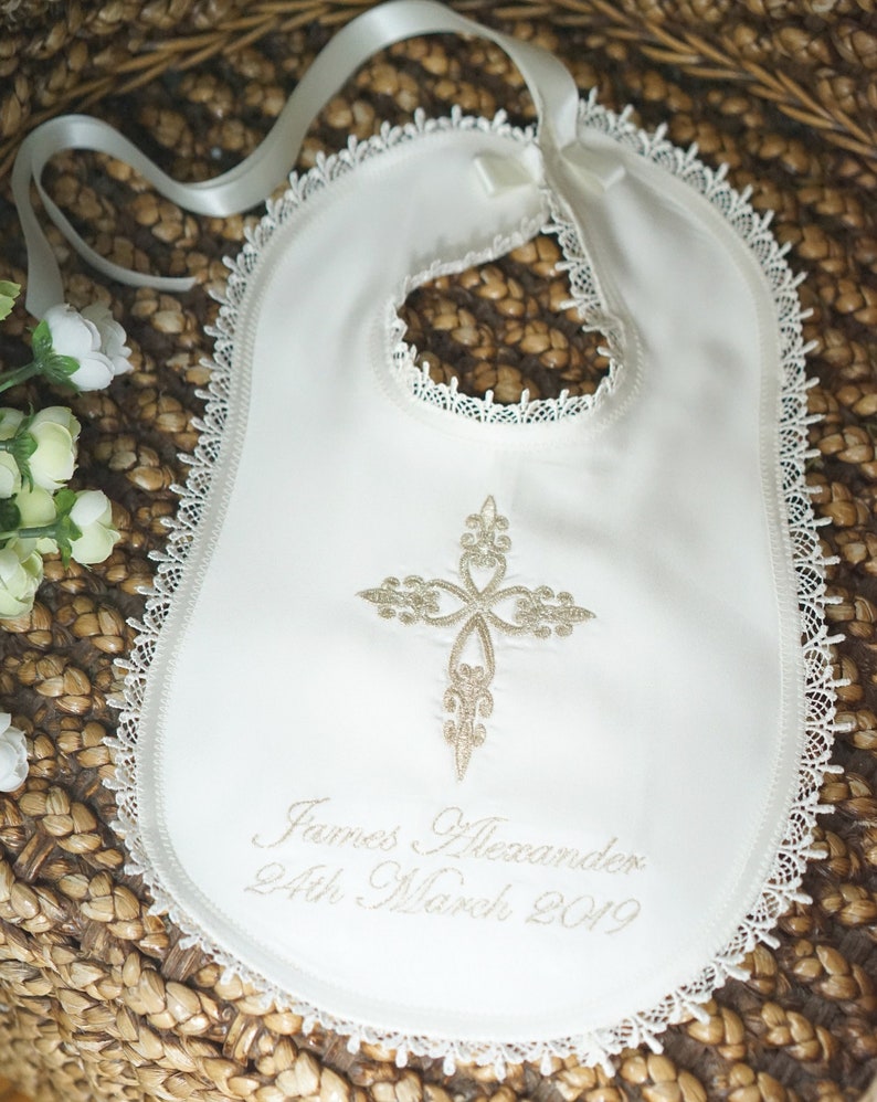 Gold intricate embroidery on a baby Baptism blanket with matching bib from www.lyubove.co.uk Lyubove Christenings