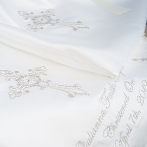 Gold intricate embroidery on a baby Baptism blanket with matching bib from www.lyubove.co.uk Lyubove Christenings