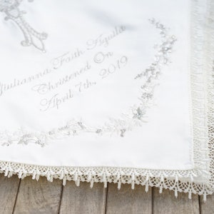 Gold intricate embroidery on a baby Baptism blanket with matching bib from www.lyubove.co.uk Lyubove Christenings