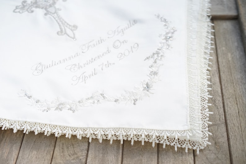 Gold intricate embroidery on a baby Baptism blanket with matching bib from www.lyubove.co.uk Lyubove Christenings