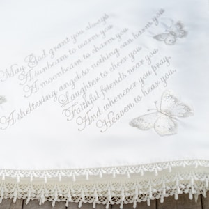 Gold intricate embroidery on a baby Baptism blanket with matching bib from www.lyubove.co.uk Lyubove Christenings