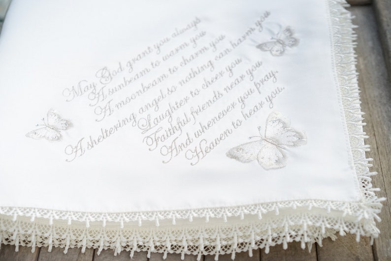 Gold intricate embroidery on a baby Baptism blanket with matching bib from www.lyubove.co.uk Lyubove Christenings