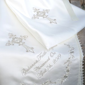 Gold intricate embroidery on a baby Baptism blanket with matching bib from www.lyubove.co.uk Lyubove Christenings