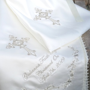 Gold intricate embroidery on a baby Baptism blanket with matching bib from www.lyubove.co.uk Lyubove Christenings