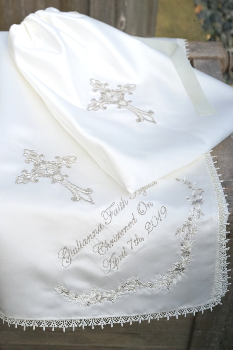 Gold intricate embroidery on a baby Baptism blanket with matching bib from www.lyubove.co.uk Lyubove Christenings